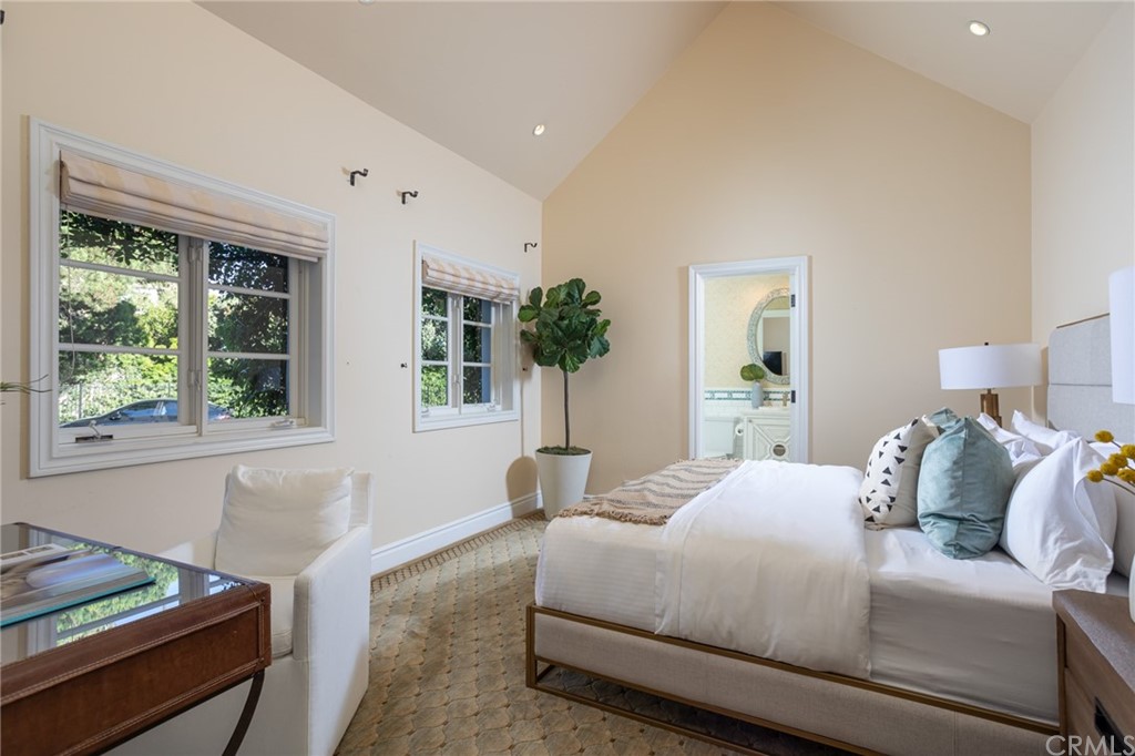 40 Smithcliffs Road Laguna Beach, CA 92651 - Photo 24 of 50 a bedroom with a large bed and windows