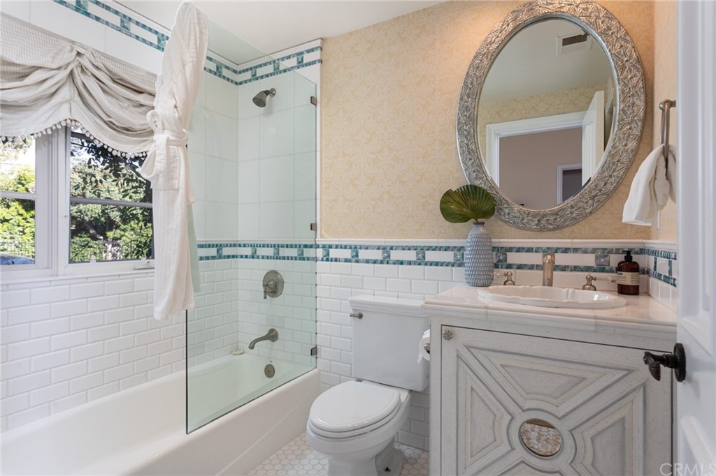 40 Smithcliffs Road Laguna Beach, CA 92651 - Photo 25 of 50 a bathroom with a sink a toilet and a mirror