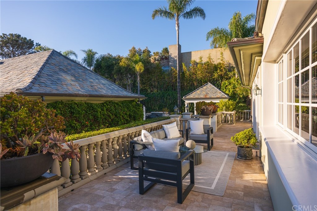 40 Smithcliffs Road Laguna Beach, CA 92651 - Photo 30 of 50 a view of a patio with table and chairs potted plants