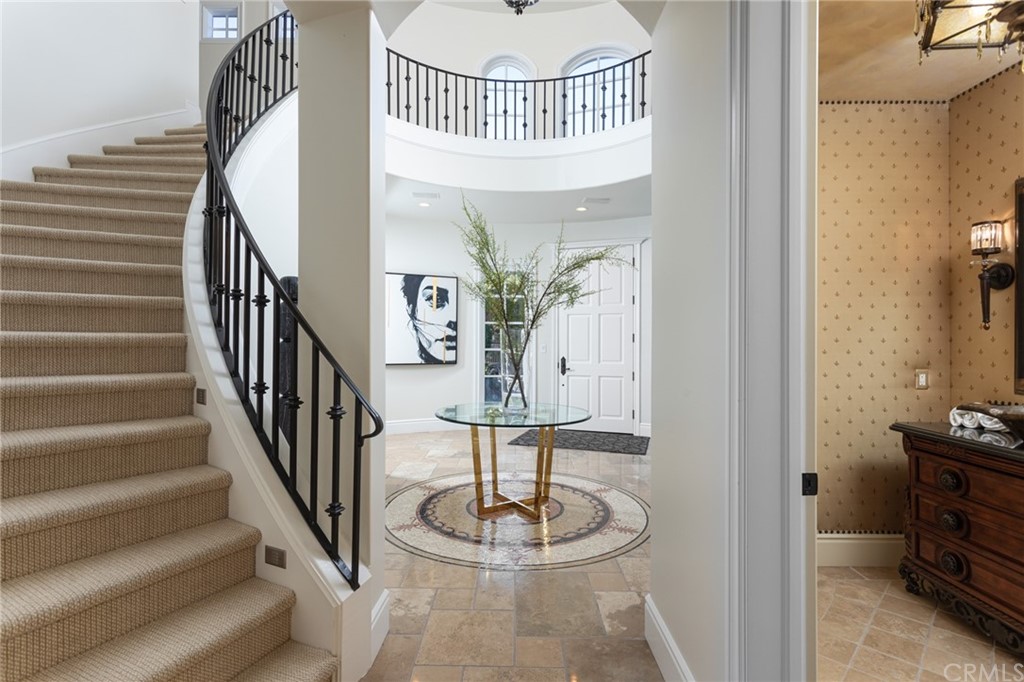 40 Smithcliffs Road Laguna Beach, CA 92651 - Photo 5 of 50 a view of a hallway with wooden floor and staircase