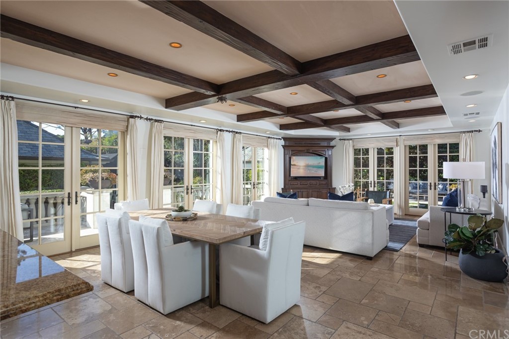 40 Smithcliffs Road Laguna Beach, CA 92651 - Photo 10 of 50 a dining room with furniture a fireplace and potted plants