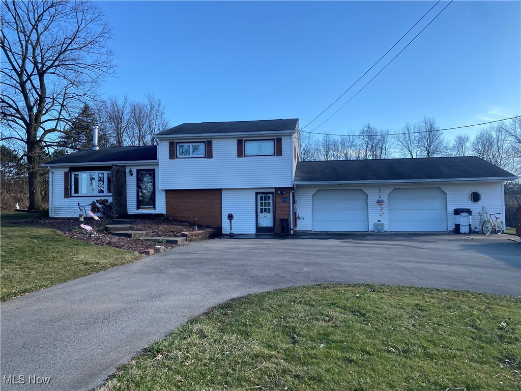 30173 Georgetown Road Salem, OH 44460 - Photo 1 of 23 Tri-level home featuring a front yard, a garage, and driveway
