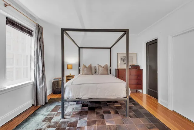 a kitchen with stainless steel appliances granite countertop white cabinets and white stove