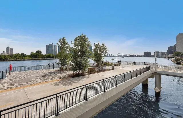 a spacious bathroom with a toilet sink and mirror