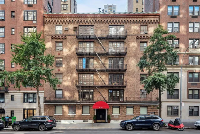 a view of a lake with a city skyline in the background