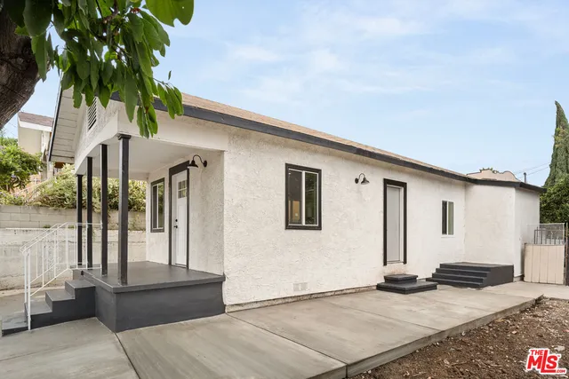 a backyard of a house with seating space