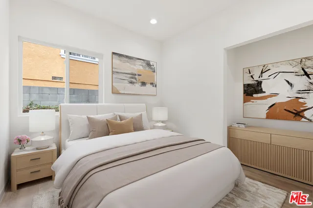 a bed room with a bed and a window