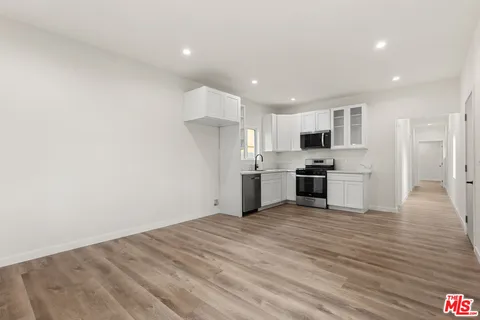 a view of kitchen with wooden floor