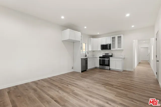 a view of kitchen with wooden floor