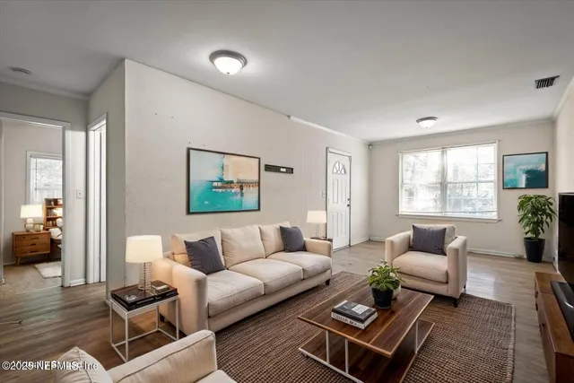 a living room with furniture and a window