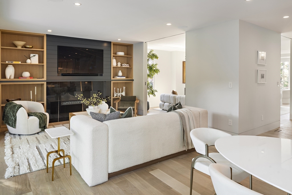 115 Mandalay Road Newton, MA 02459 - Photo 11 of 27 a living room with furniture and a flat screen tv