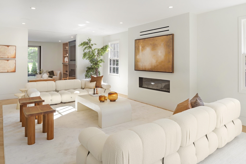 115 Mandalay Road Newton, MA 02459 - Photo 13 of 27 a living room with furniture and a flat screen tv