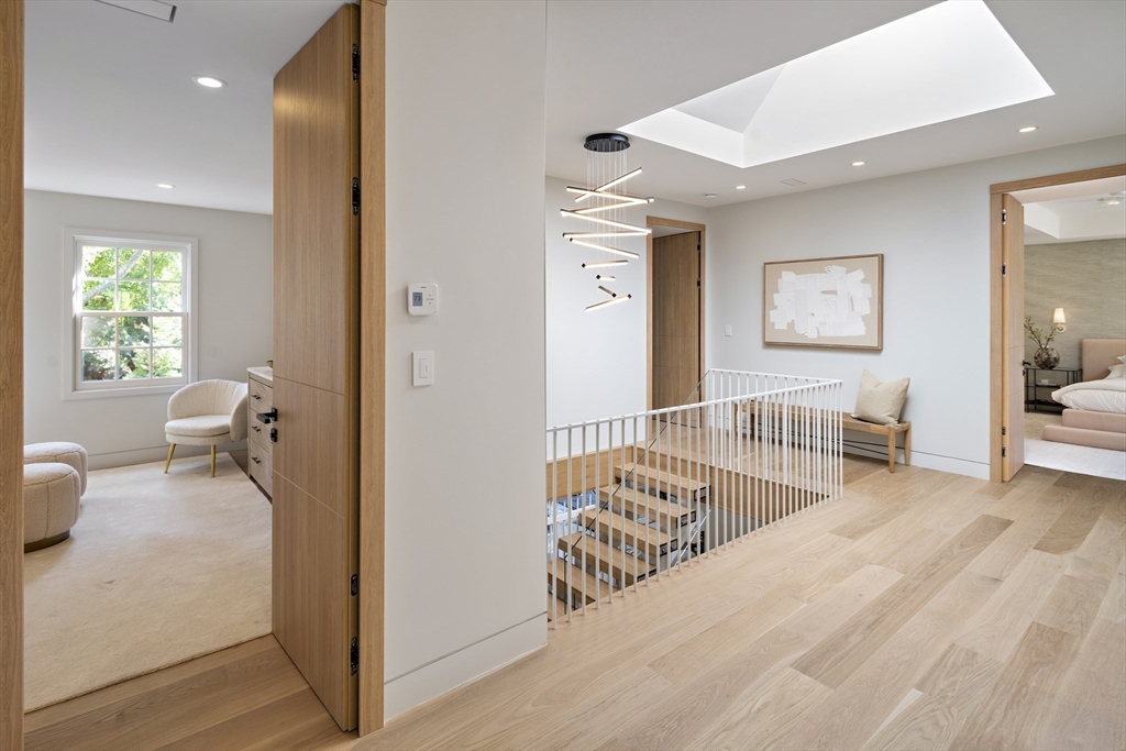 115 Mandalay Road Newton, MA 02459 - Photo 14 of 27 a view of a room with wooden floor and windows