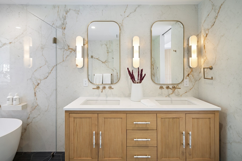 115 Mandalay Road Newton, MA 02459 - Photo 16 of 27 a bathroom with 2 sink and a mirror