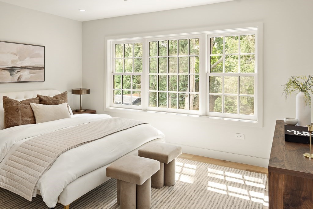 115 Mandalay Road Newton, MA 02459 - Photo 19 of 27 a bedroom with a bed and wooden floor