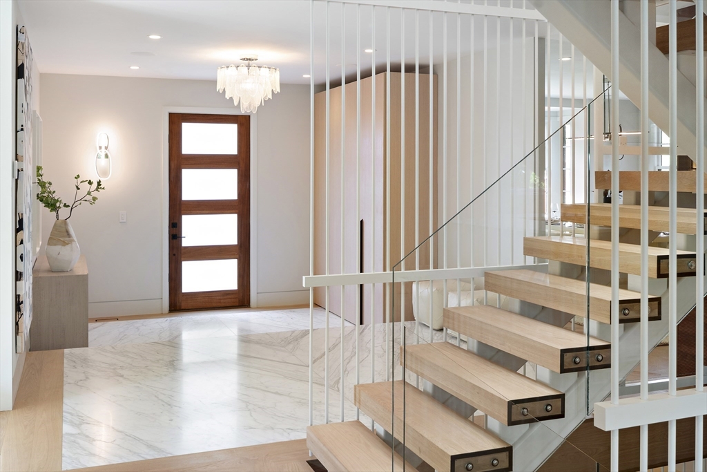 115 Mandalay Road Newton, MA 02459 - Photo 2 of 27 a view of staircase with white walls and windows