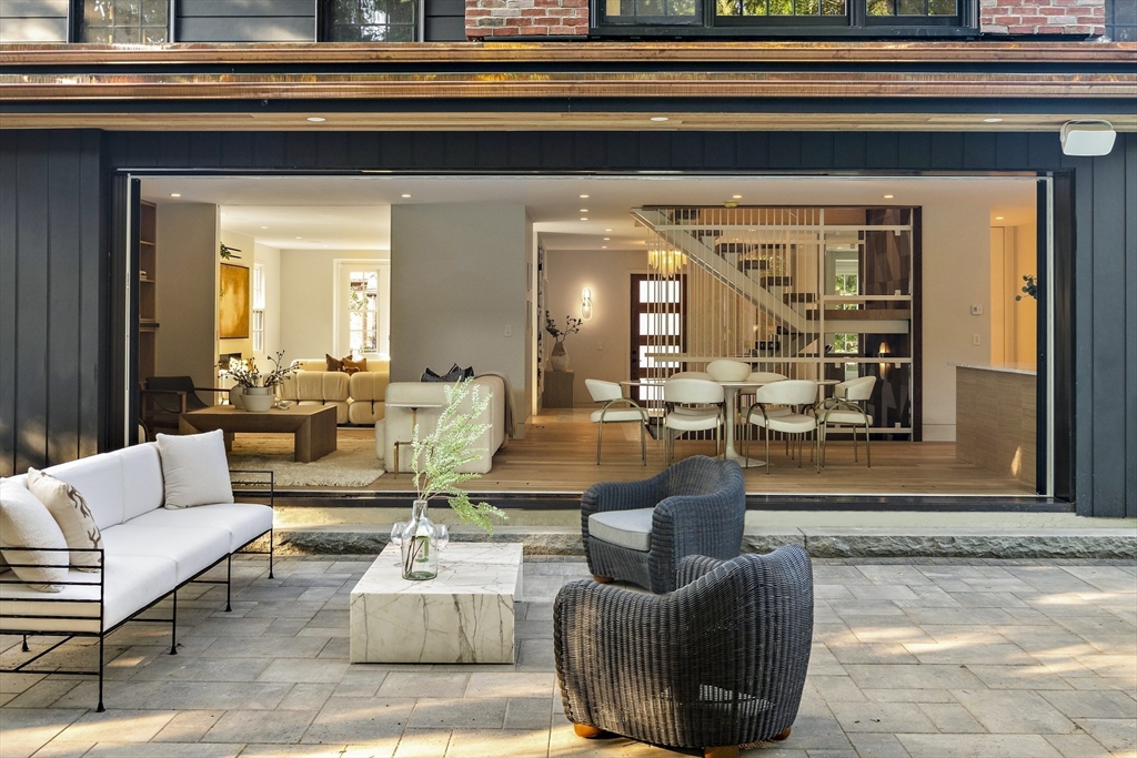 115 Mandalay Road Newton, MA 02459 - Photo 25 of 27 a living room with furniture and a potted plant