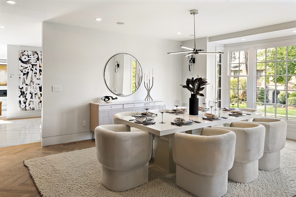 115 Mandalay Road Newton, MA 02459 - Photo 4 of 27 a living room with furniture a window and a chandelier