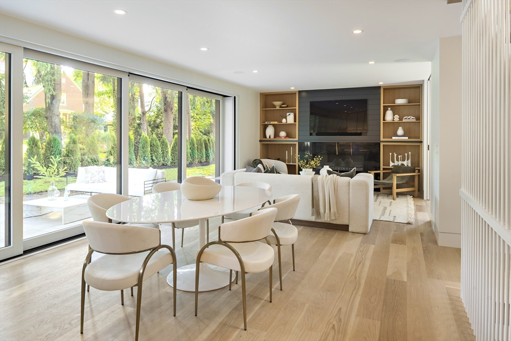 115 Mandalay Road Newton, MA 02459 - Photo 10 of 27 a dining room with furniture and large windows