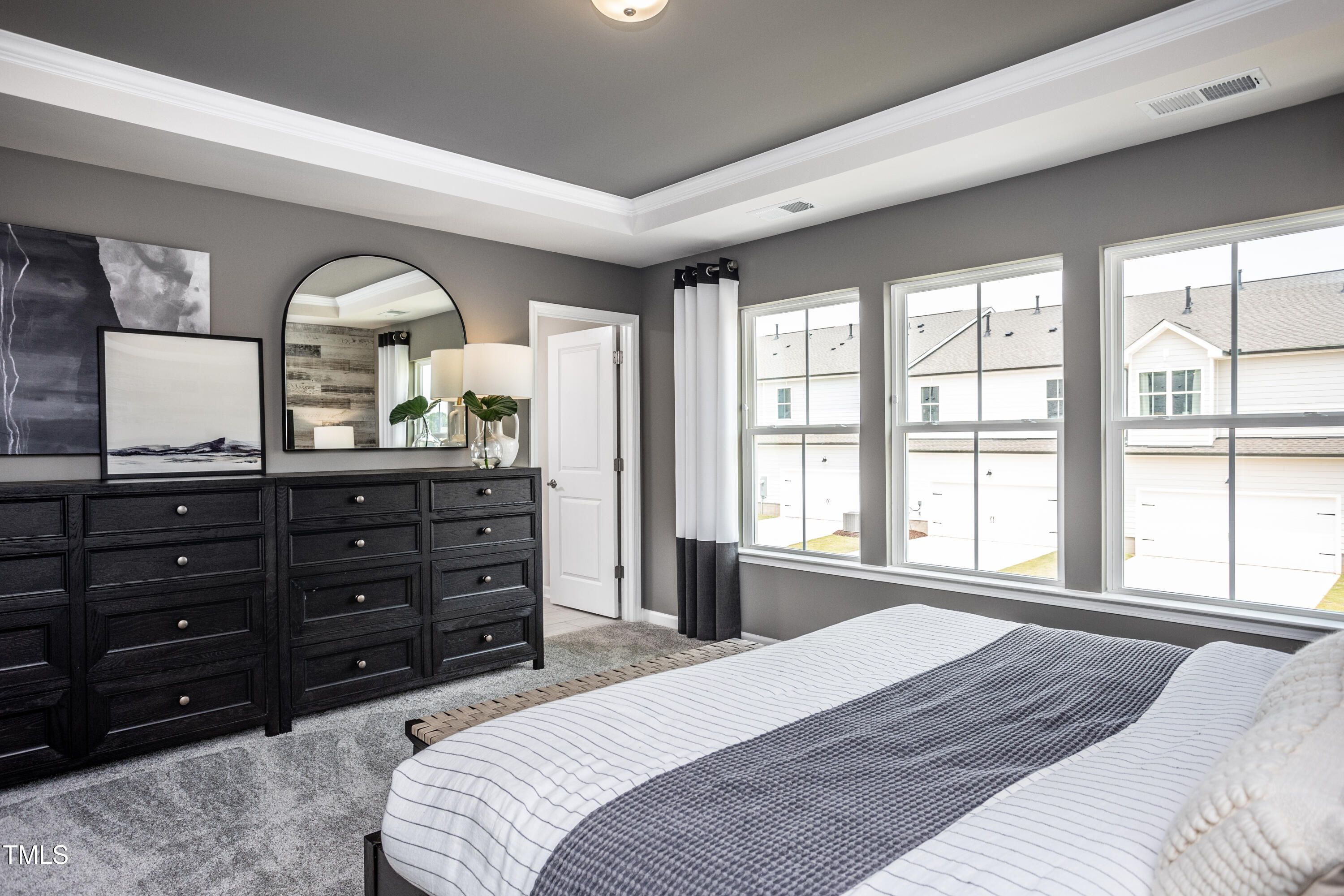 281 Brookside Drive Raleigh, NC 27603 - Photo 10 of 24 a bedroom with a bed and a large window