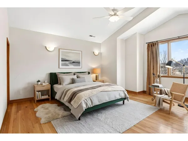 a bathroom with a granite countertop sink toilet a mirror and shower