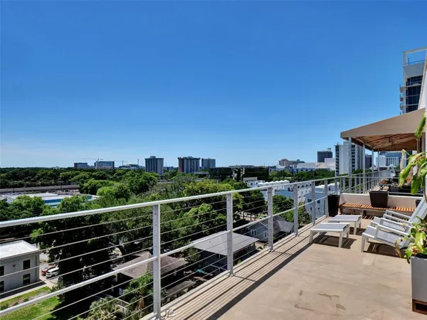 a view of balcony with furniture
