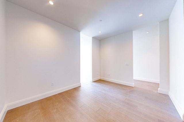 a kitchen with a cabinets and white appliances