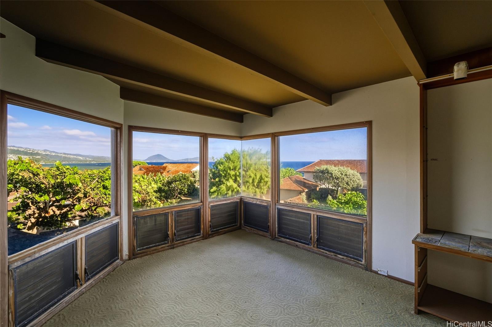 4134 Black Point Road Honolulu, HI 96816 - Photo 15 of 25 a room with large windows and furniture