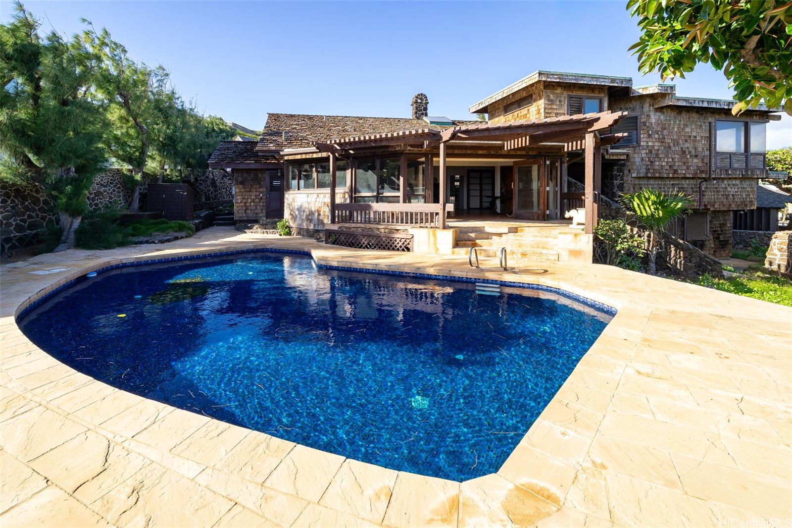4134 Black Point Road Honolulu, HI 96816 - Photo 6 of 25 a view of a house with pool table and chairs