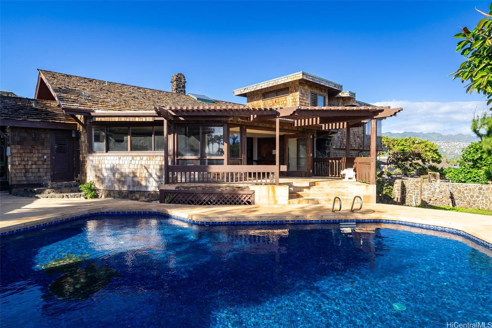 4134 Black Point Road Honolulu, HI 96816 - Photo 7 of 25 a view of a house with swimming pool and sitting area