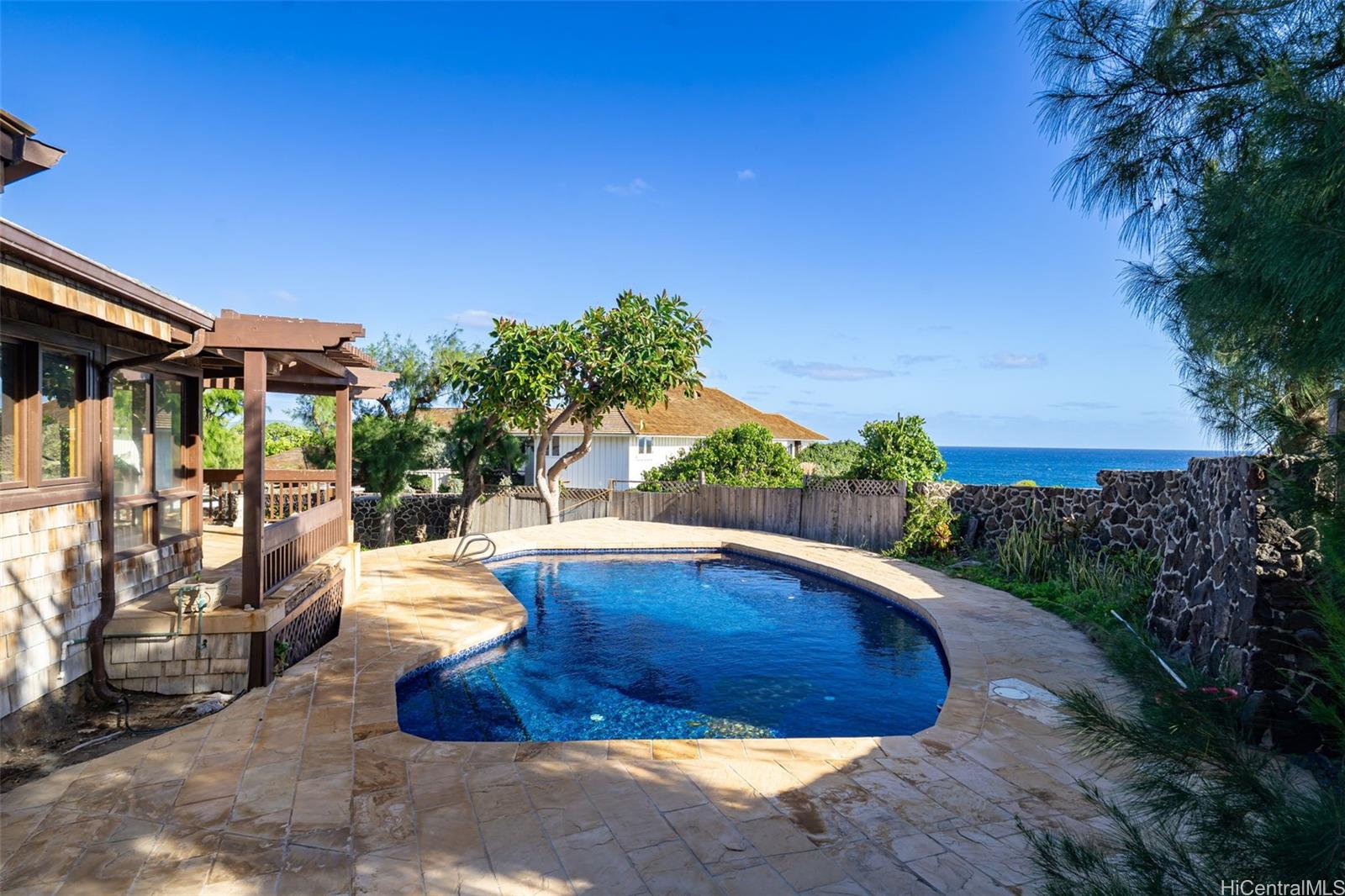 4134 Black Point Road Honolulu, HI 96816 - Photo 8 of 25 a view of a backyard with plants and a patio