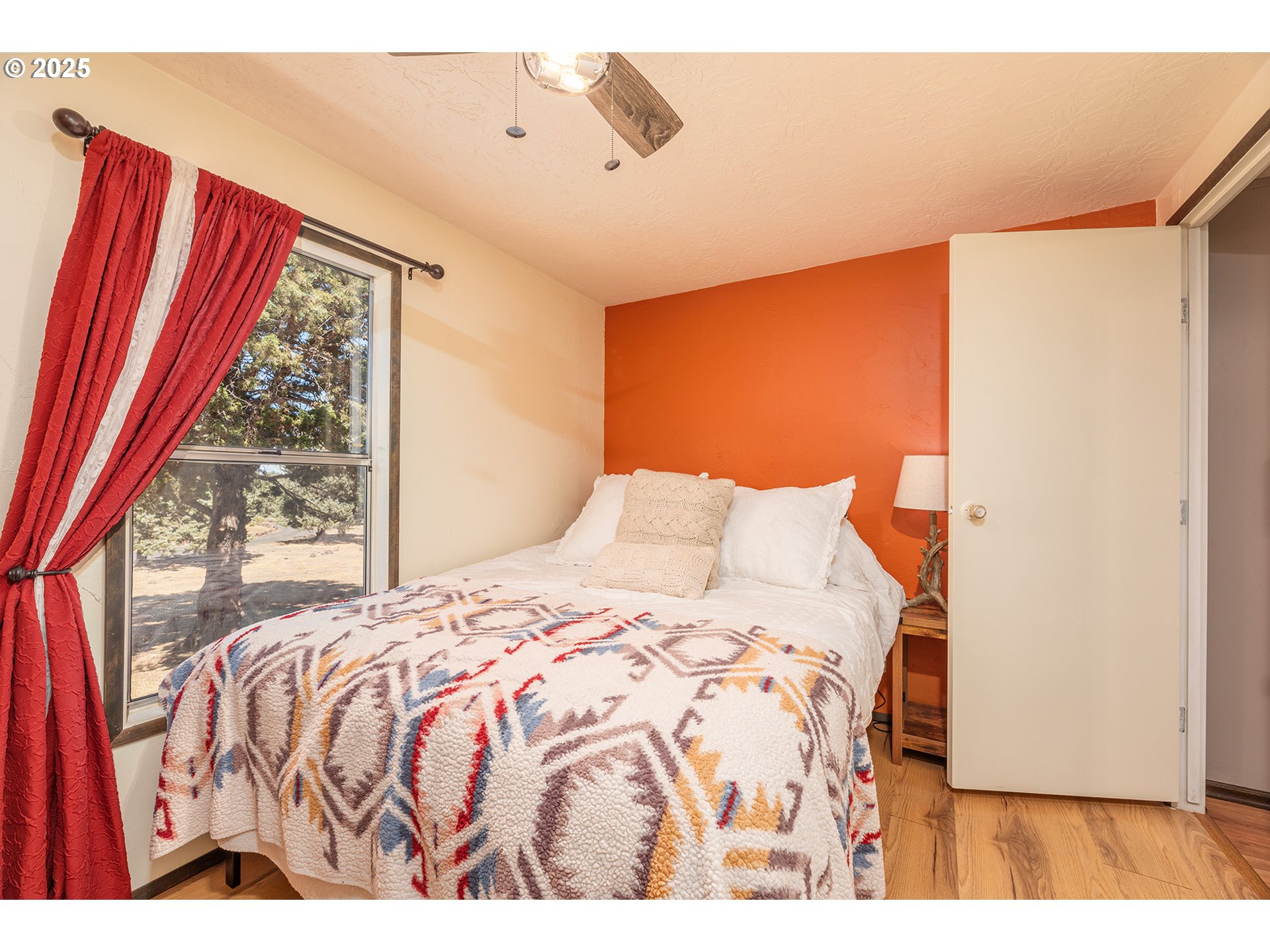 13406 Southwest Oasis Court Terrebonne, OR 97760 - Photo 18 of 48 a bedroom with a bed and a large window