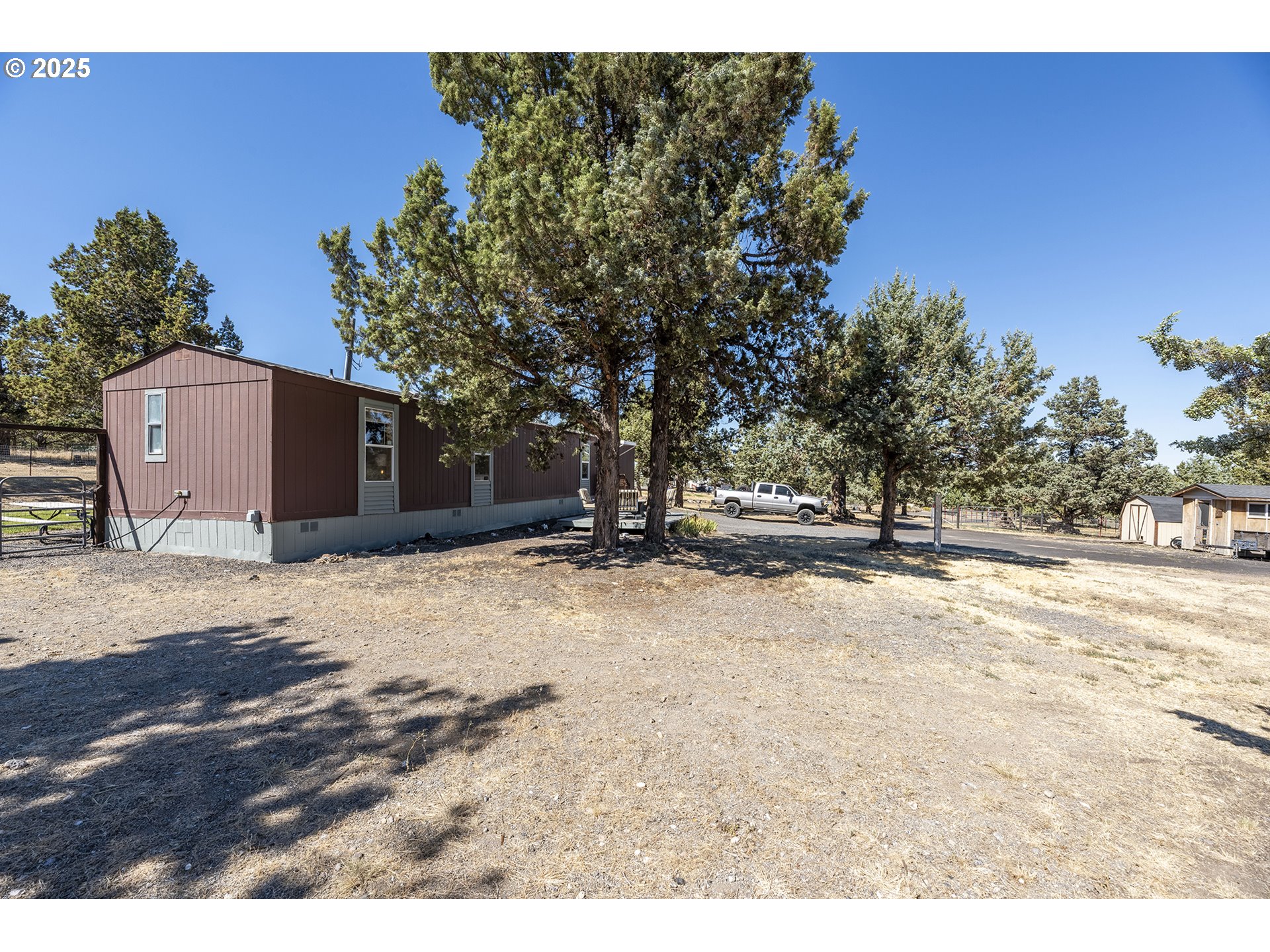 13406 Southwest Oasis Court Terrebonne, OR 97760 - Photo 2 of 48 a view of a backyard of a house