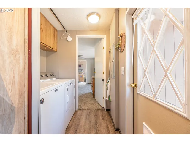a bathroom with a double vanity sink and mirror with shower