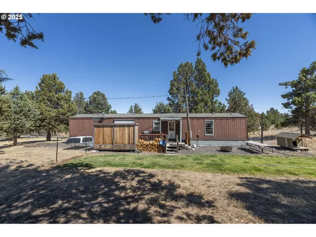 a house view with a sitting space and garden