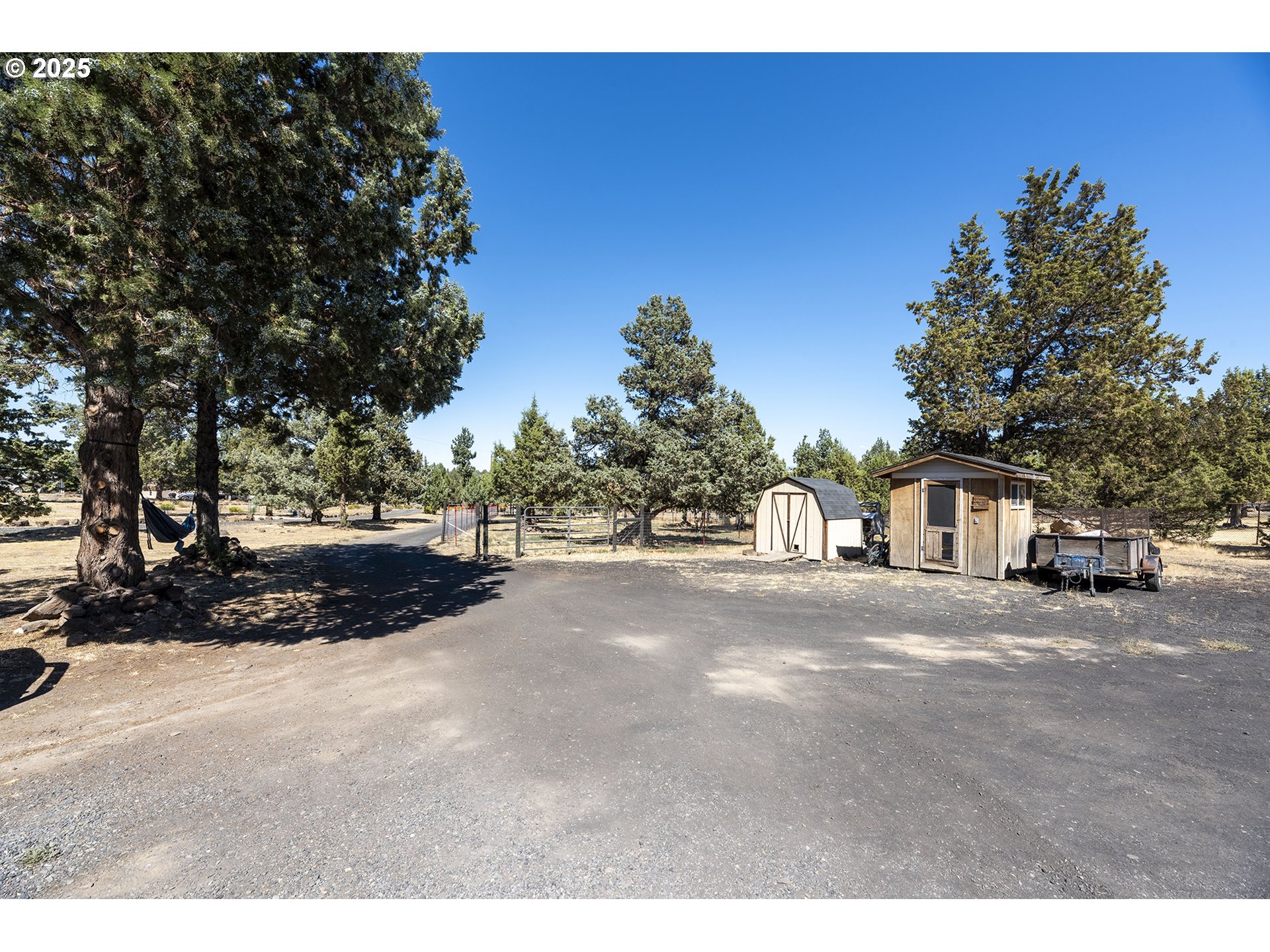13406 Southwest Oasis Court Terrebonne, OR 97760 - Photo 28 of 48 a view of a road with a building in the background