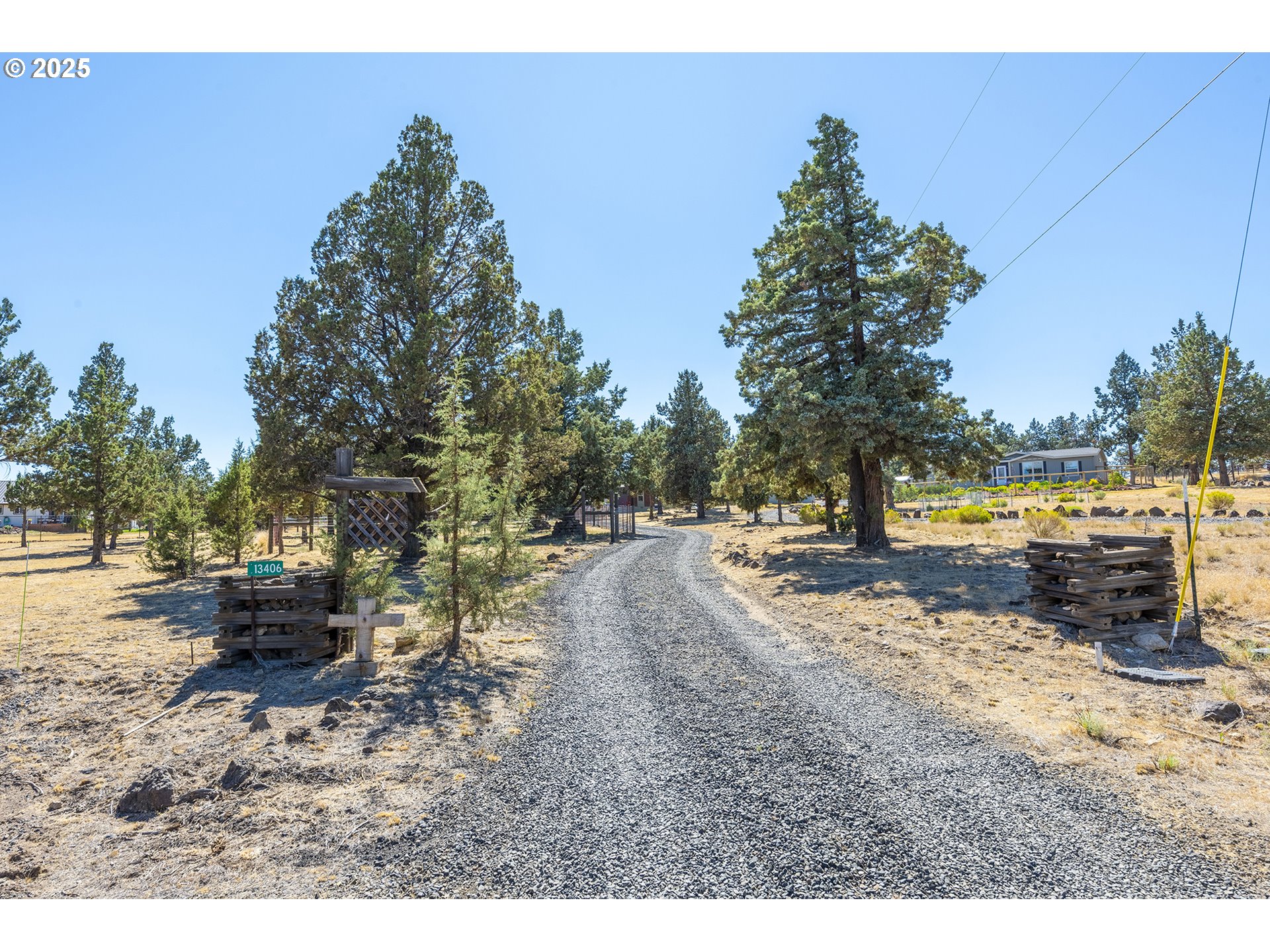 13406 Southwest Oasis Court Terrebonne, OR 97760 - Photo 29 of 48 a view of a yard with wooden fence