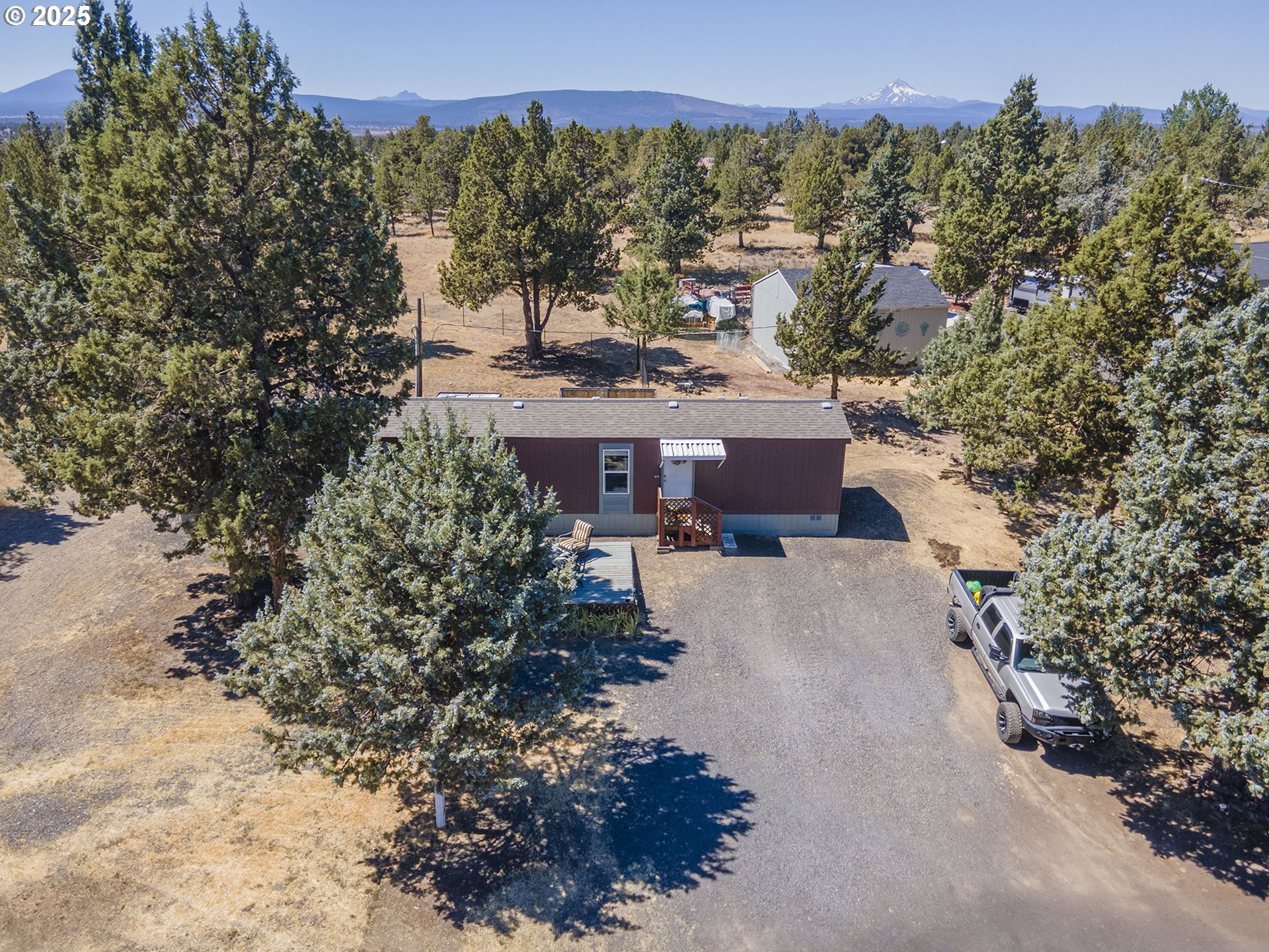 13406 Southwest Oasis Court Terrebonne, OR 97760 - Photo 31 of 48 a view of a house with a yard and a large tree