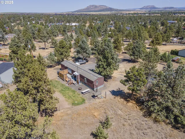 a view of a town with mountains in the background