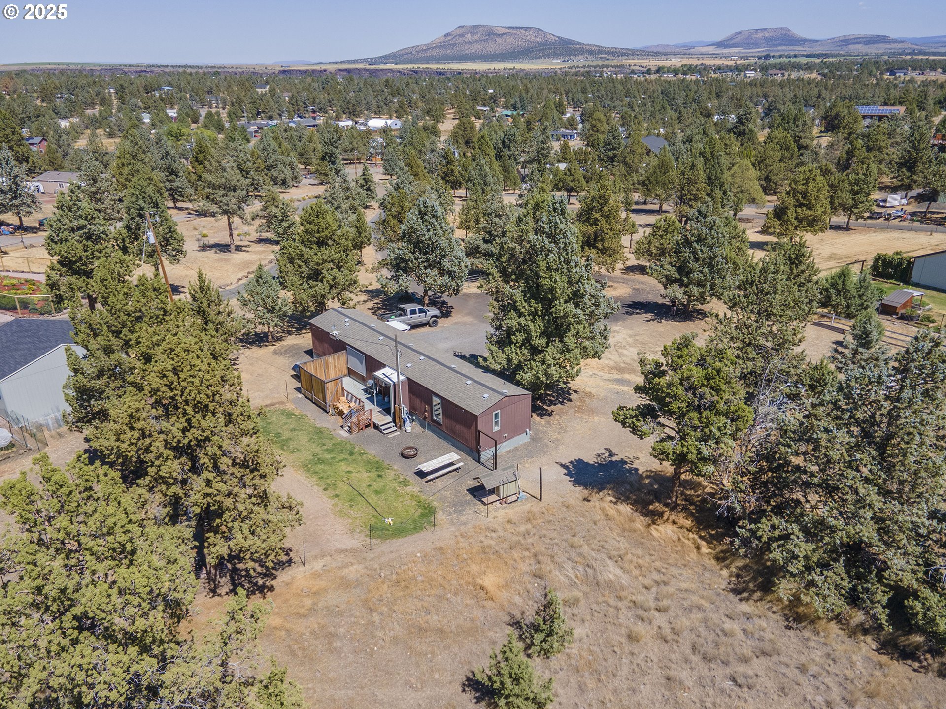 13406 Southwest Oasis Court Terrebonne, OR 97760 - Photo 35 of 48 a view of a town with mountains in the background