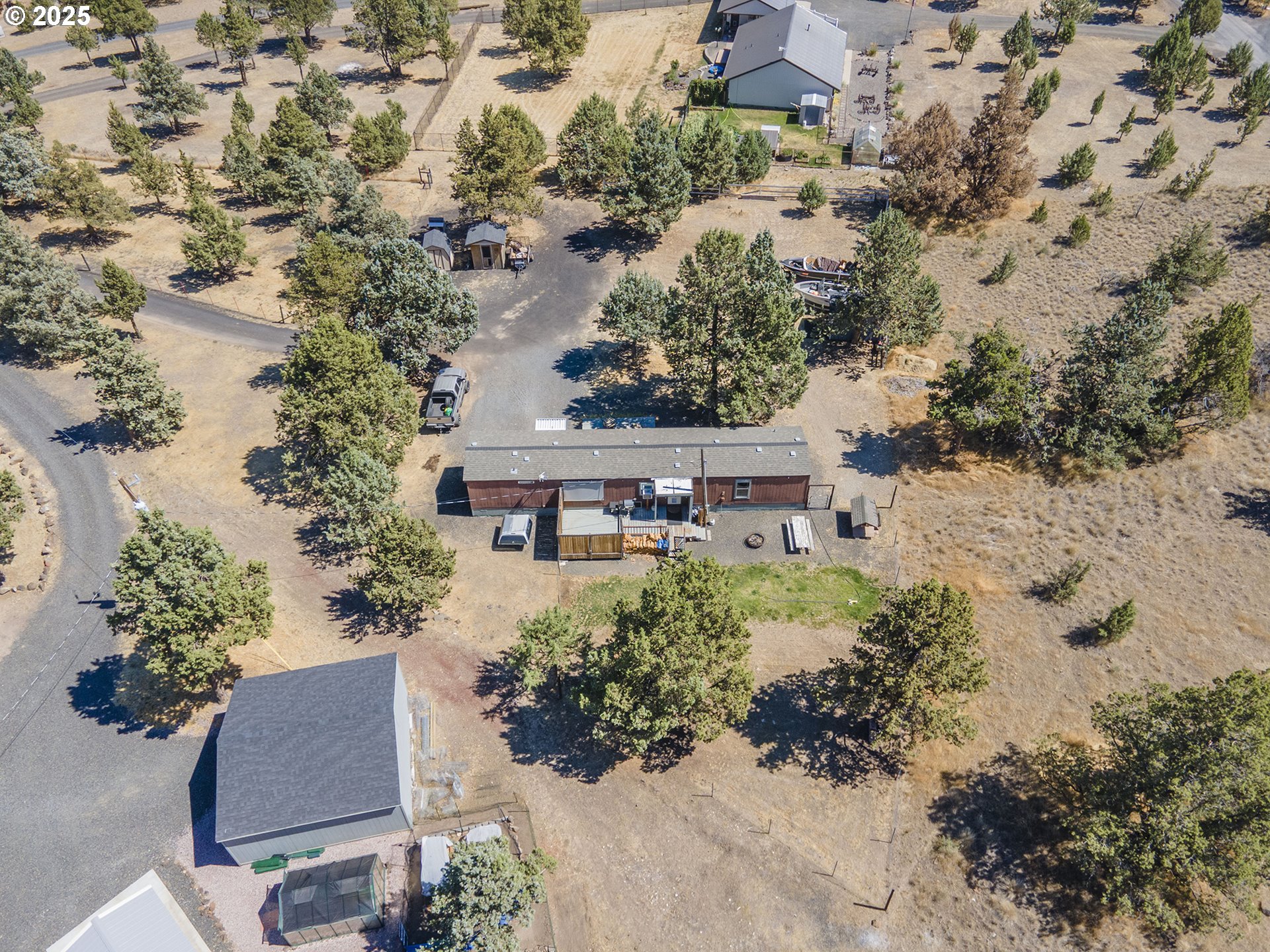 13406 Southwest Oasis Court Terrebonne, OR 97760 - Photo 40 of 48 an aerial view of a house with a yard and lake view