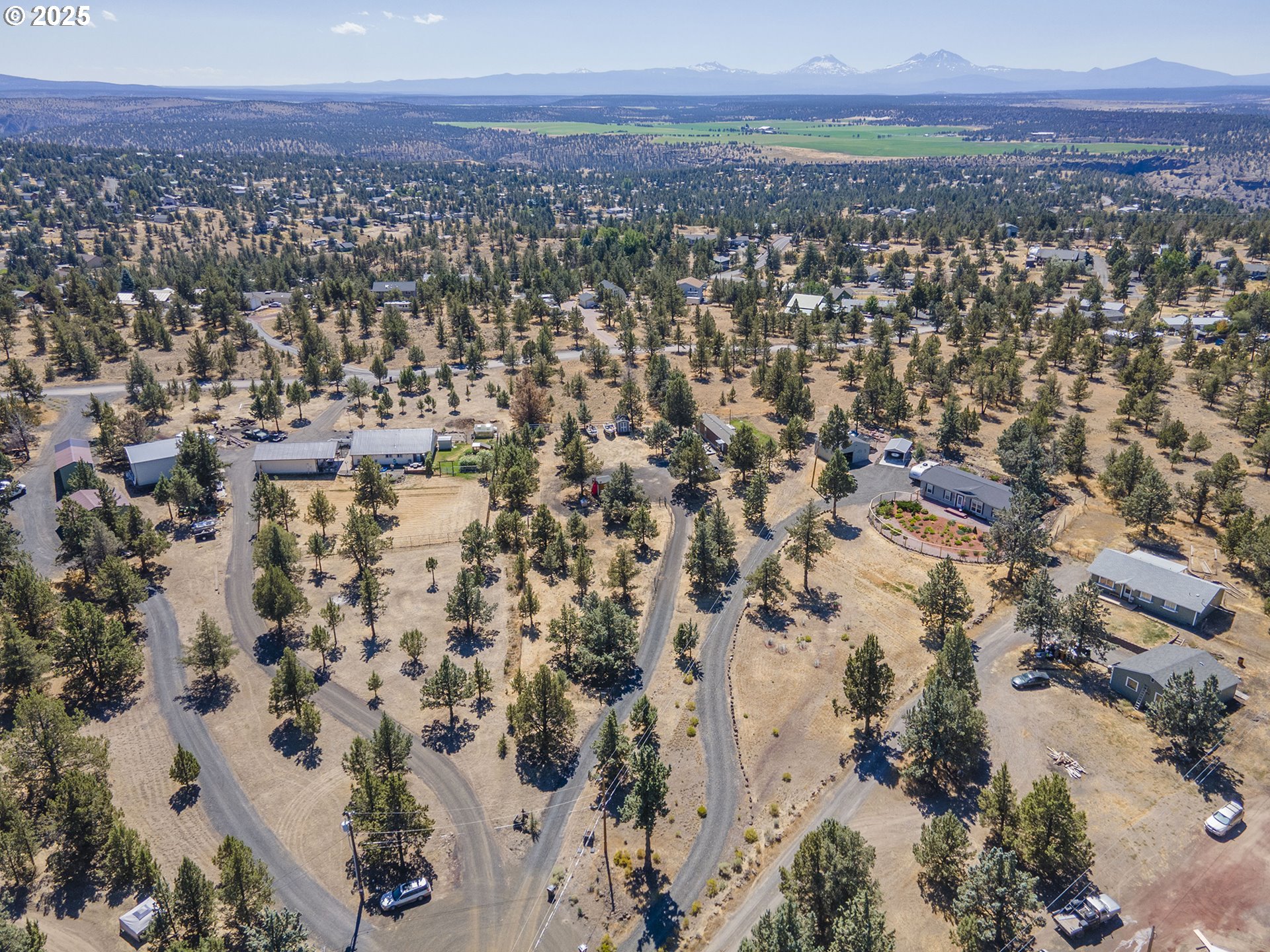 13406 Southwest Oasis Court Terrebonne, OR 97760 - Photo 43 of 48 an aerial view of residential house and sandy dunes