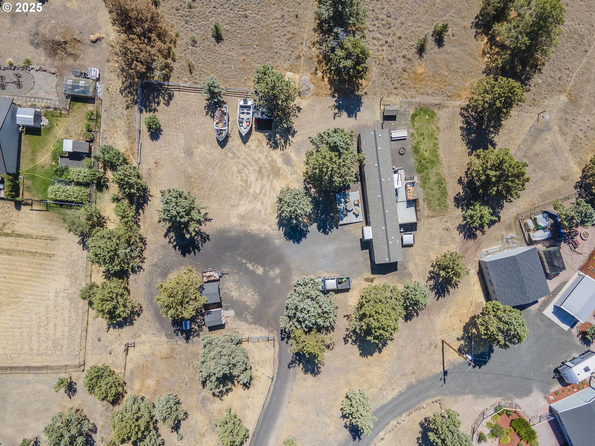 13406 Southwest Oasis Court Terrebonne, OR 97760 - Photo 46 of 48 an aerial view of a house with a yard and a wooden fence