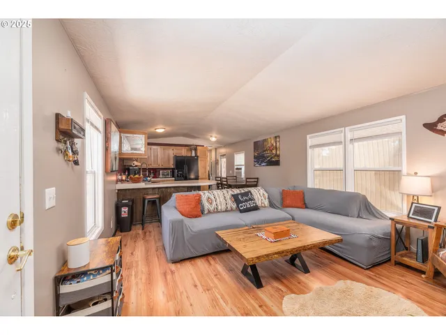 a living room with furniture and a table