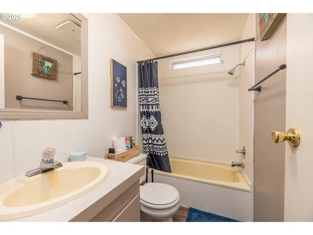 a bathroom with a sink a toilet and a bathtub