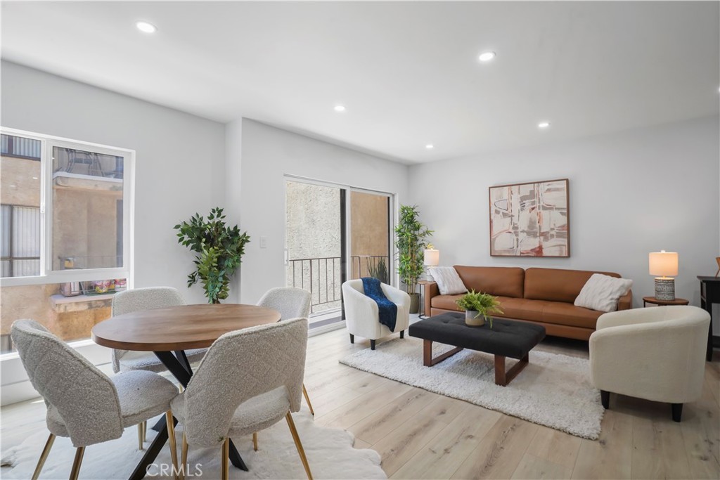 1730 Camino Palmero Street, Unit 316 Los Angeles, CA 90046 - Photo 11 of 27 a living room with furniture and a potted plant