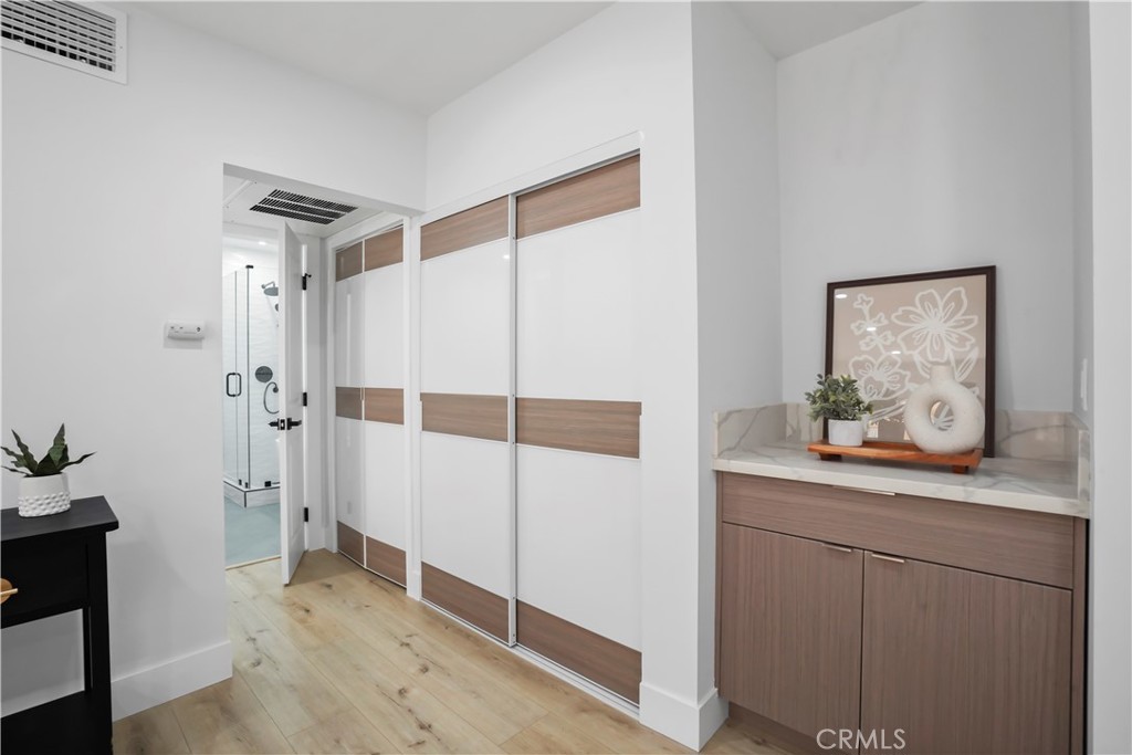 1730 Camino Palmero Street, Unit 316 Los Angeles, CA 90046 - Photo 14 of 27 a hallway that has a door and a closet