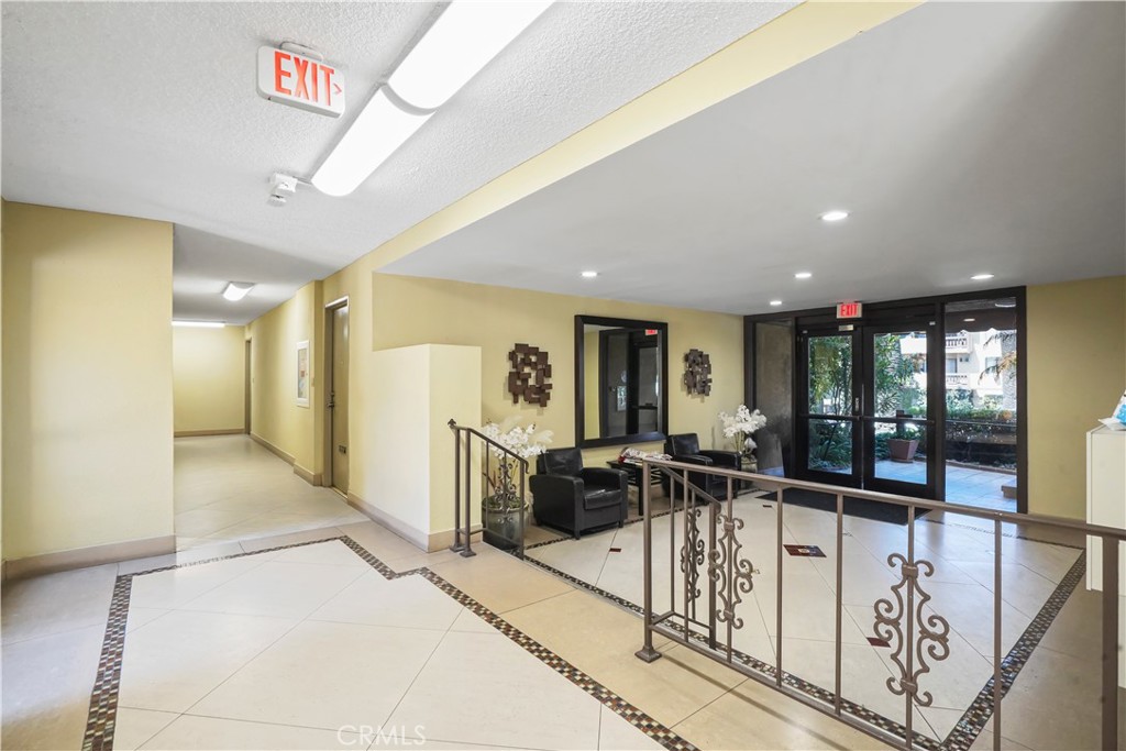 1730 Camino Palmero Street, Unit 316 Los Angeles, CA 90046 - Photo 21 of 27 a view of a hallway with furniture