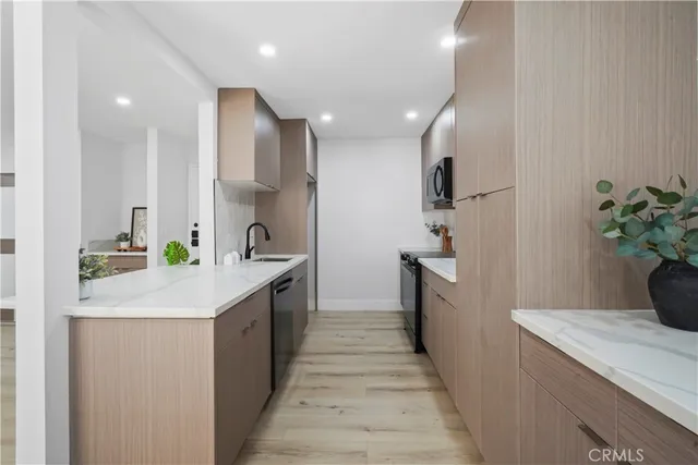 a kitchen with a sink and stove in it