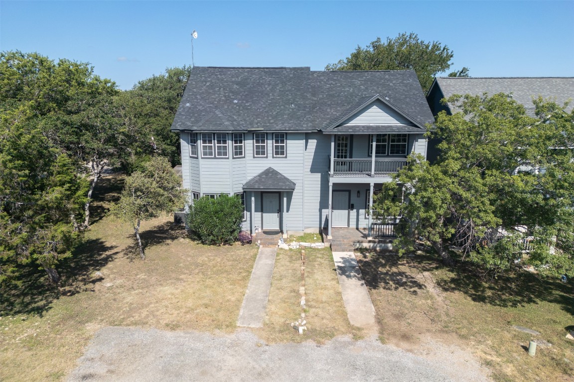 38 Deer Ridge Road Wimberley, TX 78676 - Photo 1 of 1 Traditional home with roof with shingles and covered porch